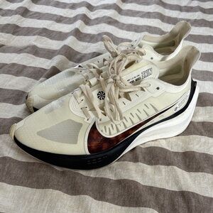 Nike Zoom Gravity Cream and Black Trainers with Brown Swoosh Accent